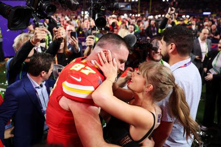 Travis Kelce and Taylor Swift embrace after defeating the San Francisco 49ers  in overtime during Super Bowl LVIII at Allegiant Stadium on February 11, 2024.